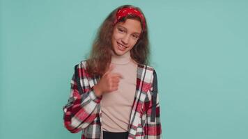 Child girl kid pointing down, saying to subscribe, gesturing ok, like, showing place for information video