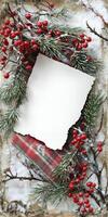 Rustic holiday card with blank white torn edges surrounded by pine and berries for Christmas design photo