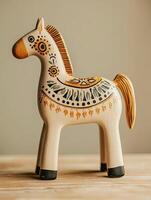 Scandinavian wooden horse figurine close up. Nordic craft and design inspiration photo