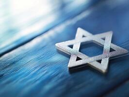 Hanukkah celebration with star of David on blue wooden background photo