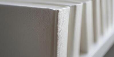Close up of white textured surface with unique ridges and shadows photo