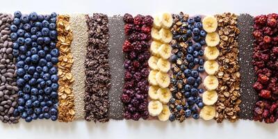 Colorful assortment of fruits, nuts, and grains in stripes on white background photo