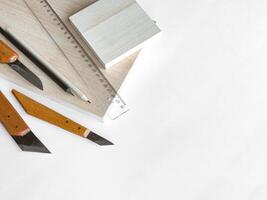 Precision crafting tools set on white surface with measurement ruler and wooden handles photo