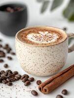 Relaxing coffee break with a ceramic cup of cappuccino on white background photo