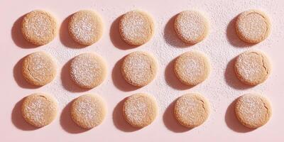 Flat lay of gingerbread cookies on a pastel background with powdered sugar highlight photo