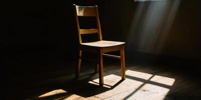 Contemplative scene featuring a simple wooden chair in sunlit room highlighting emotional burnout photo