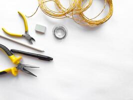 Diy electronics tools and materials on white background photo