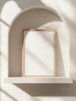 Minimalist Scandinavian light wooden framed poster on arched shelf with soft shadows photo
