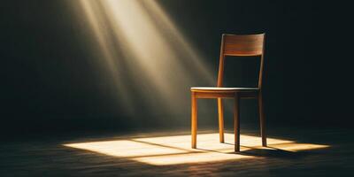 Emotional burnout concept featuring a simple wooden chair in dramatic spotlight for stress awareness photo