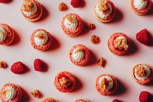 Delicate raspberry macarons topped with cream and golden crumble photo