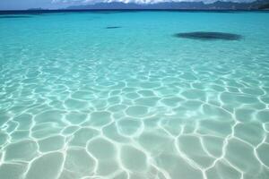 Crystal-clear turquoise water with sunlit ripples creates a serene and refreshing seascape photo