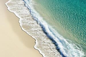 Tranquil Shoreline Crystal Clear Waves Meeting Golden Sand photo