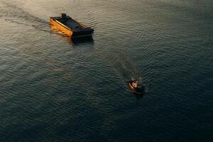 Canadian tugboat departing Vancouver, canada with an Empty rock barge in tow. photo