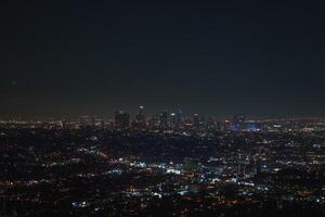 Nighttime View of Los Angeles Skyline with Illuminated Skyscrapers photo