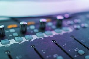 Close Up of Audio Mixing Console with Colorful Illumination photo