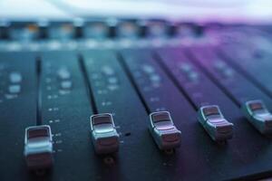 Close Up of Audio Mixing Console with Faders in Los Angeles Studio photo