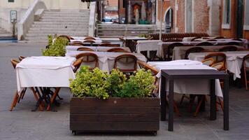 Outdoor restaurant tables and chairs on the Venetian street video