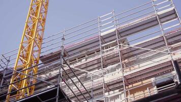 Construction site with a crane and scaffolding for work video