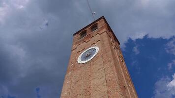 Ancient clock tower with clouds in the background video