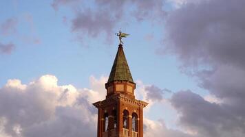 Ancient bell tower with clouds in the background video