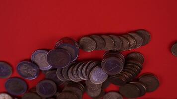 Coins scattered on the red table video