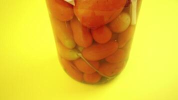 Tomatoes enclosed in the glass container for winter video