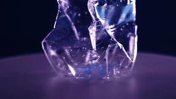 Folded bottle spins on a black background video