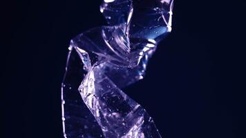Folded bottle spins on a black background video