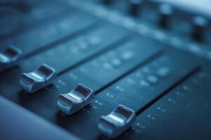 Close Up of Professional Audio Mixing Console with Faders photo