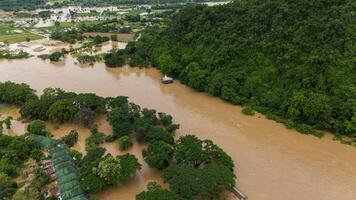 Aerial view of white Buddha statue situated on the rock while Mae Kok river rising during typhoon Yagi has swept Southeast Asia. photo