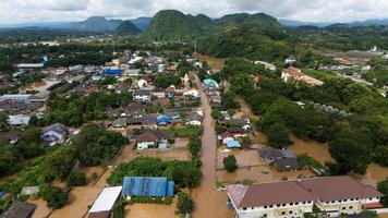 Aerial view of suburb area in Chiang Rai province flooding by Kok river after typhoon Yagi has swept Southeast Asia. photo