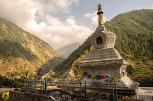Tibetan Buddhist pagoda in Syabrubesi village a beautiful resident village inside the Langtang National Park of Nepal. photo