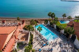 Resort Pool and Beach View in Benalmadena, Spain with Unique Architecture photo