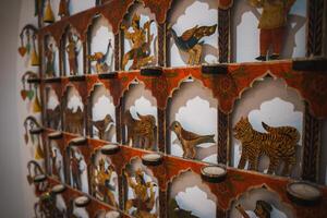 Intricate Wall Display with Arched Niches and Hand Painted Figures photo