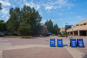 UCLA Campus Event with Directional Signs and Modern Architecture photo