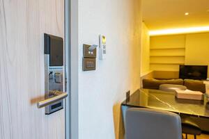 The room has a digital on off system. Electronic door handle with key card to lock and unlock door, access control keycard. Digital door lock security systems for access protection of hotel door. photo