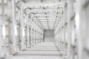 Top angle view of the white reinforced steel bar framework column construction in the work site. photo
