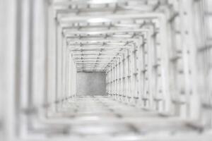 Top angle view of the white reinforced steel bar framework column construction in the work site. photo