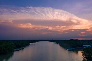 the Twilight time from drone view on the Thailand River in rural area. Chachoengsao province, East of Thailand. photo