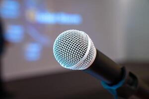 microphone is on microphone stand in seminar meeting room for everyone to use when speaking or greeting seminar participants. photo
