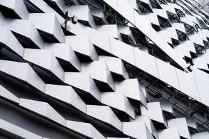 modern Aluminium composite material architecture gray color and Hexagon shape popup texture on exterior facade building. photo