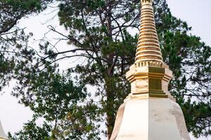 Wat Phra That Doi Tung, a famous Temple and Buddhism place. It's settled on the mountain in Chiang Rai province, north of Thailand. photo