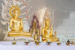 A stunning golden Buddha sculpture, exemplifying the deep reverence and devotion of Thai individuals in their spiritual worship. photo