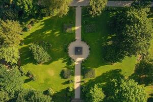 Aerial view of a symmetrical park with pathways and lush greenery. photo