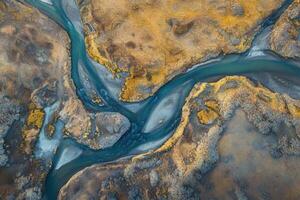 Aerial view of a river meandering through a desolate landscape. photo