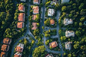 Aerial view of residential neighborhood, houses nestled amongst lush green trees and winding roads. photo