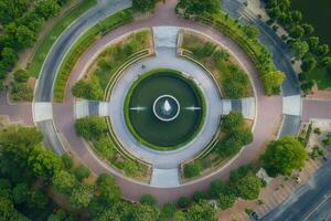 Aerial view of a circular park with fountain. photo