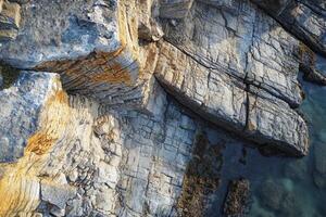 Aerial view of coastal rock formations. photo