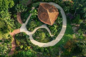 Aerial view of a tropical garden with a unique pavilion. photo