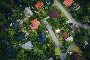 Aerial view of a residential neighborhood with houses and lush green trees. photo